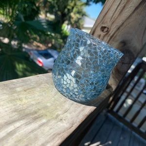 Blue mirrored glass candle holder.